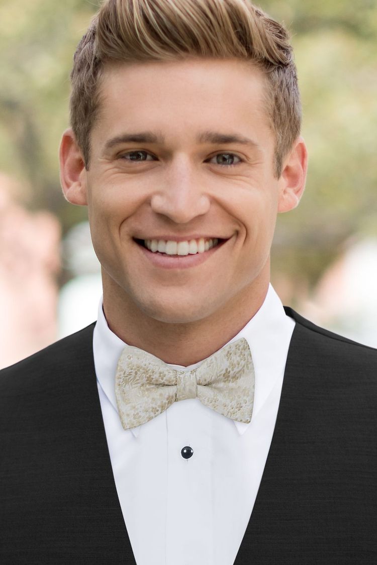 Wearing a Floral Champagne Bow Tie with a black vest