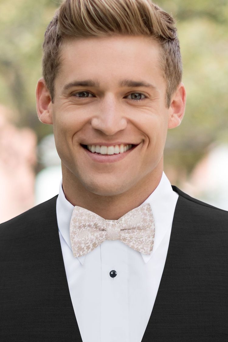 Man wearing a Floral Taupe Bow Tie in a black vest