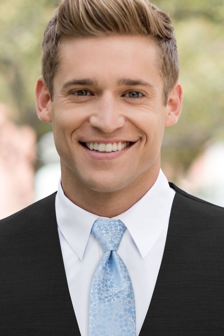 Man wearing a Floral Lite Blue Windsor Tie with a black vest