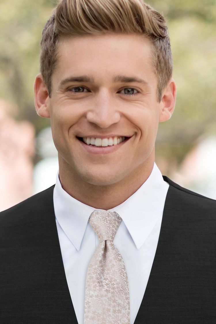 Man wearing a Floral Taupe Windsor Tie with a black vest