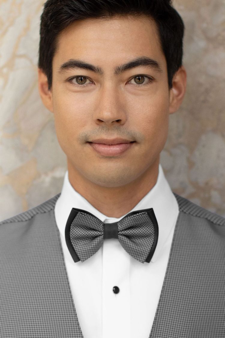 Man wearing a foundation bow tie steel grey with a matching vest