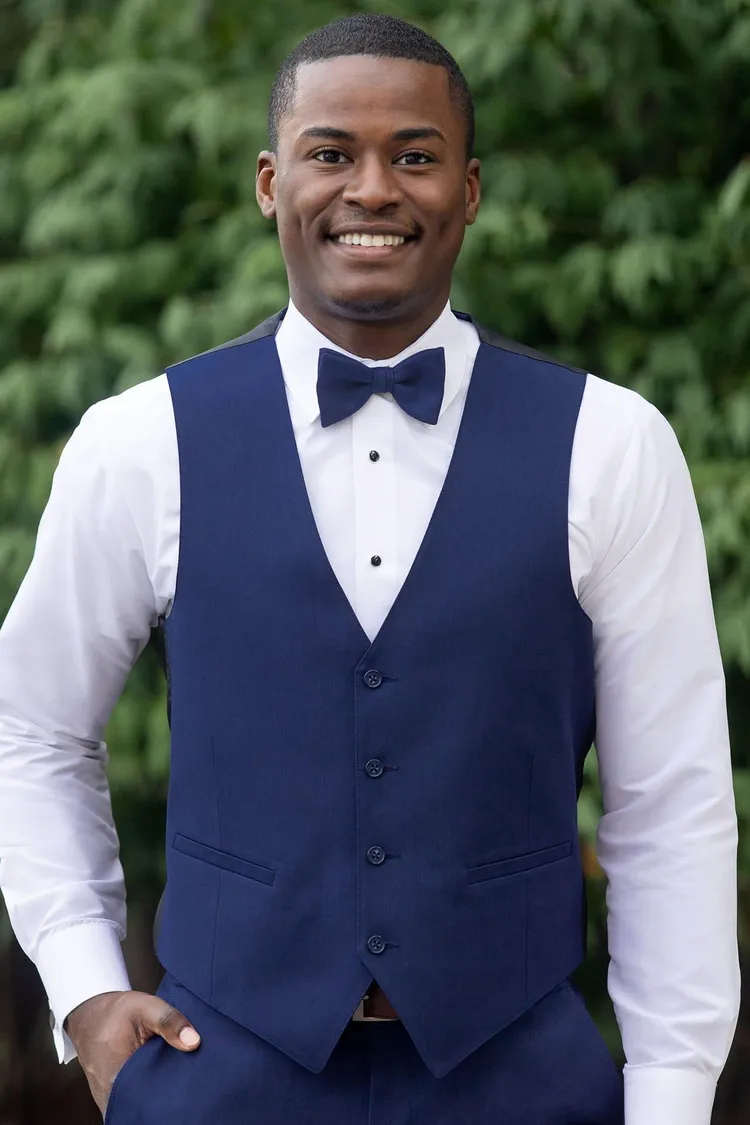 Guy wearing a Matching Blue Performance Stretch Fullback Vest and matching bow tie