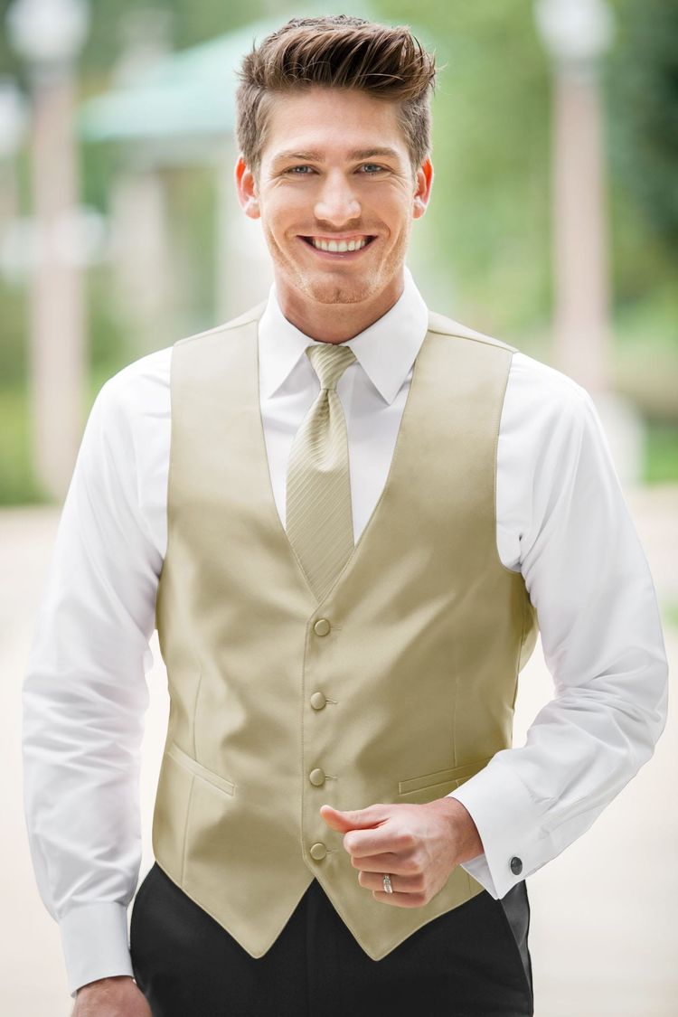Guy wearing the Expressions Champagne Fullback Vest and matching tie