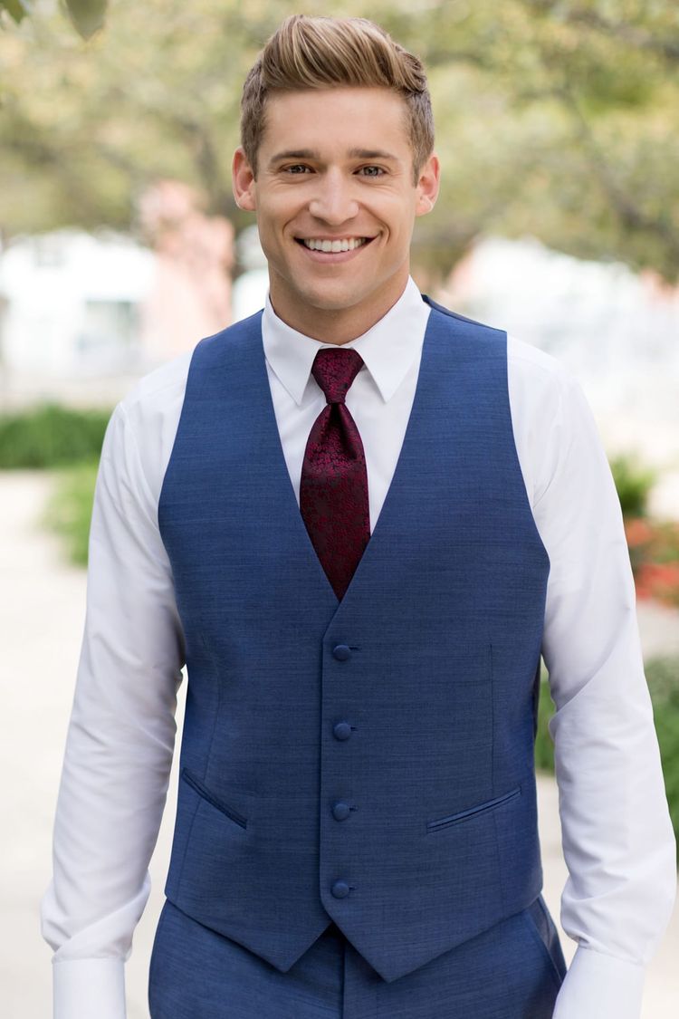Guy wearing a Matching Indigo Blue Fullback Vest and floral wine tie